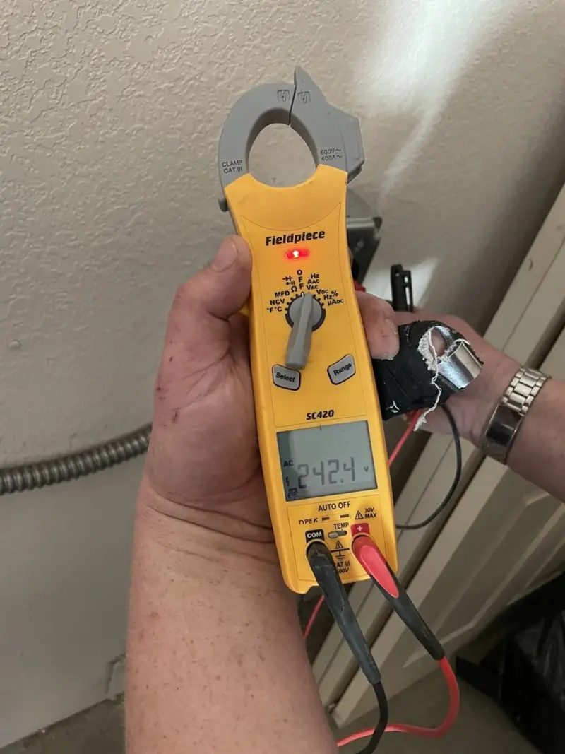 Voltage testing with clamp meter during Ceiling Fan Installation in Rogersville